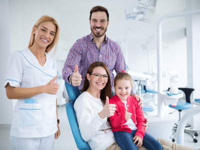 Entire family visits a dentist office for clean, healthy teeth.